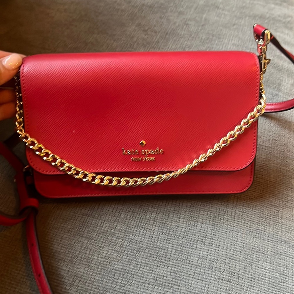 New with tags, Kate Spade bag. Cherry red which is the color of the season.